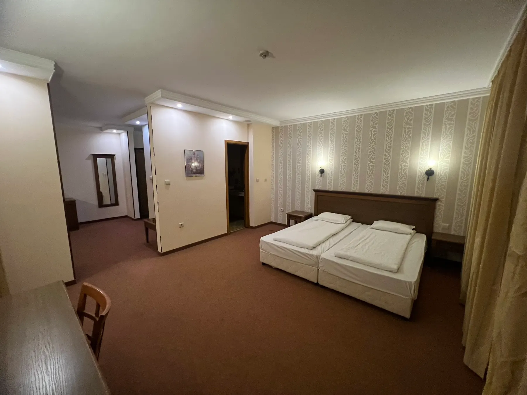 Junior suite — from the living room through to the bedroom with two beds